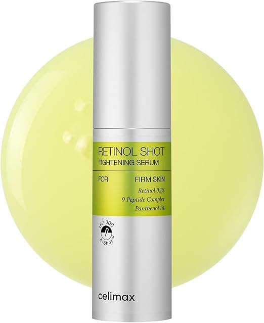 Frasco prateado do Celimax Retinol Shot Tightening Serum sobre respingo amarelo